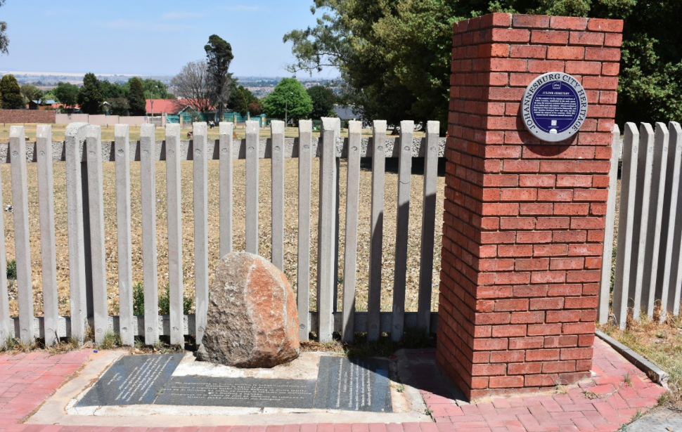 Juliwe blue heritage plaque awarded by the City of Johannesburg stands alongside a community